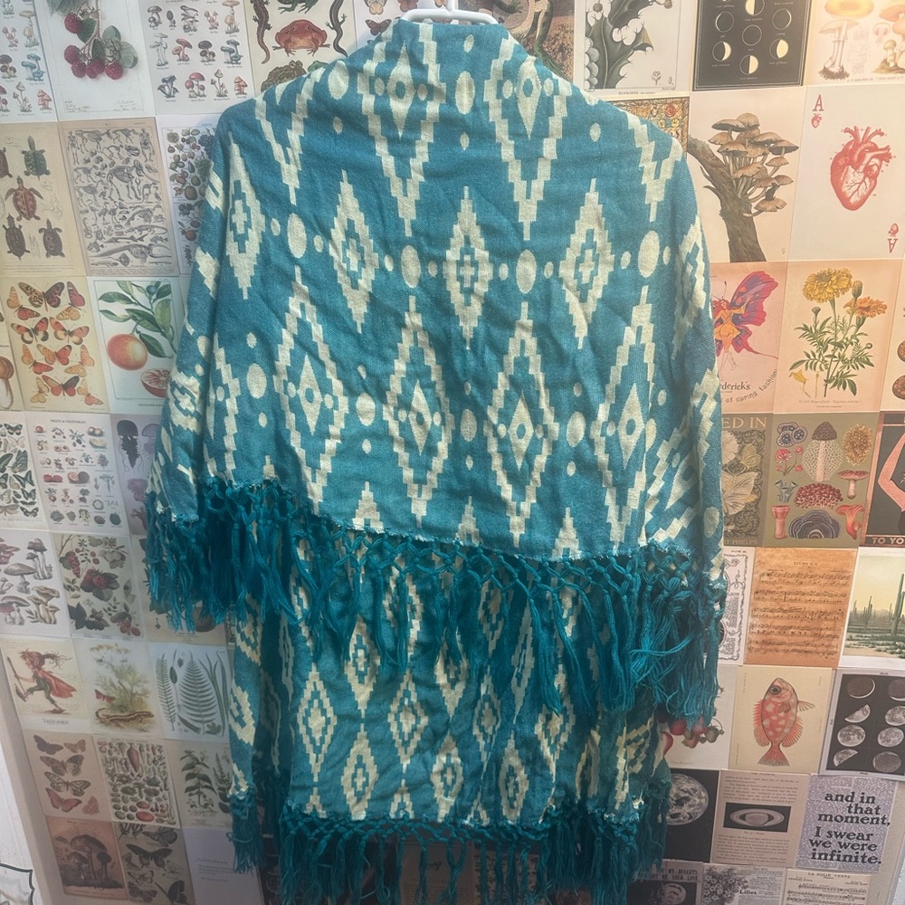 Raj brand, India made. One size. Shawl/poncho type fit. Drapes and has arm hole